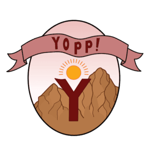 The logo for Yopp the social justice blog: A cartoon style illustration of a dark red letter Y with a yellow sun above it, creating the impression of a rejoicing person. The Y is lined up with the valley of two tan mountains behind it. The illustration is contained in a tall oval with a pale pink background and a rose colored banner across the top that says Yopp! in dark red letters.