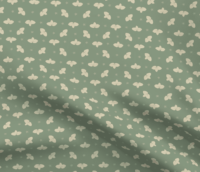 A repeat pattern with yellow clusters of three leaves, their veins outlined clearly in gold. The leaf clusters are lined up in rows with lots of space in between, mirrored horizontally or vertically from the previous one. In between the leaves are little mint star-shaped flowers. The leaves and flowers are done in a paper-cut style on a green background. The pattern is demoed in a small size on a piece of rippling fabric.