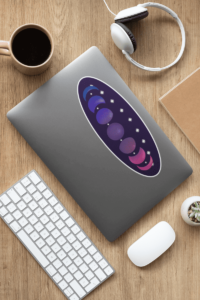 7 phases of the moon in a gradient of the bisexual pride colors: blue, purple, and magenta. It is demoed on a large, oval, dark purple sticker, 10 inches long, with a white border, on the back of a silver laptop.