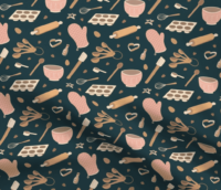 A repeat pattern of baking tools, like rolling pins, oven mitts, muffin tins, measuring and mixing spoons, whisks, spatulas, and cookie cutters, in a cute cartoon style, in a pink, orange, and beige color palette on a navy blue background. The pattern is demoed on a piece of rippling fabric.
