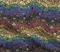 A repeat pattern of mosaic tiles in a series of colorful waves. The tiles are stripes matching the Philadelphia pride flag, red, orange, yellow, green, blue, purple, black, and brown and the textured grout is black. The design is demoed on a rippling piece of fabric.