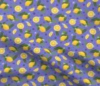 A repeat pattern of lemons, lemon slices, and lemon wedges, interspersed with green leaves, ferns, small dark and light blue flowers. The background is purple with small blue dots. The pattern is demoed on a piece of rippling fabric.
