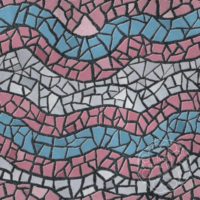 A repeat pattern of mosaic tiles in a series of colorful waves. The tiles are stripes matching the transgender pride flag, baby blue, pink, and white, and the textured grout is dark grey. There is a faint watermark in the bottom right corner that says Kella Hanna-Wayne & Co.