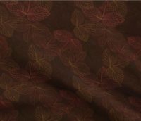 A repeat pattern of stamp art of the veins from a cluster of three leaves, in varying shades of orange, yellow, and brown. The clusters of leaves overlap only slightly and are facing in all different directions. The stamps are on a brown background. The pattern is demoed on a piece of rippling fabric.